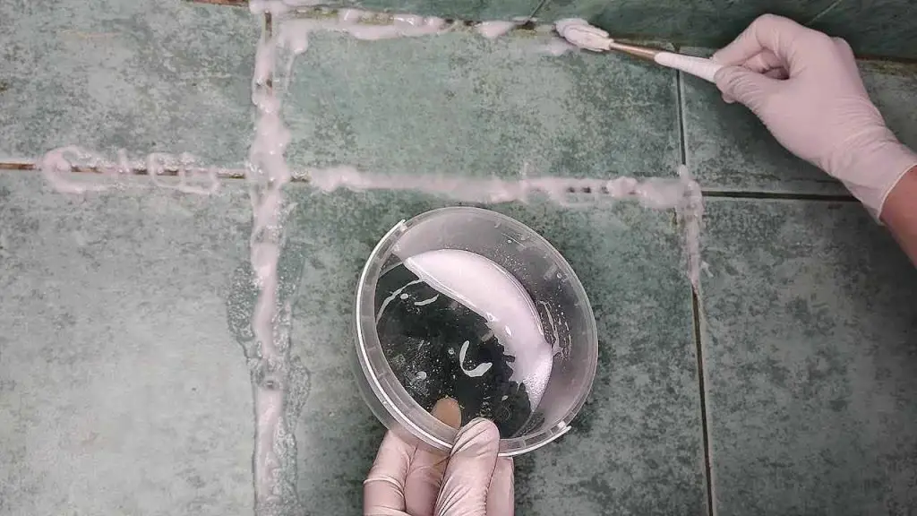 This natural compound will make the black joints between the tiles white again